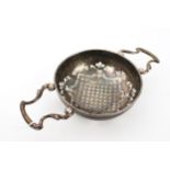 A George II silver orange or lemon strainer.