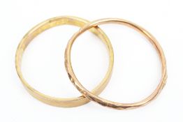 Two early 20th century 9ct rose gold slave bangles.