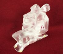 A Lalique glass model of a male and female.