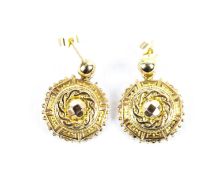 A pair of Victorian gold round pendant earrings.