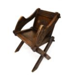 A late 19th century oak 'Glastonbury' chair.