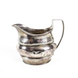 A George III silver oval milk jug.