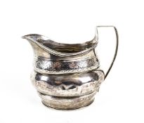 A George III silver oval milk jug.