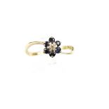 A 9ct gold sapphire and tiny diamond cluster ring. Hallmarks for London 1980, size N+, 1.