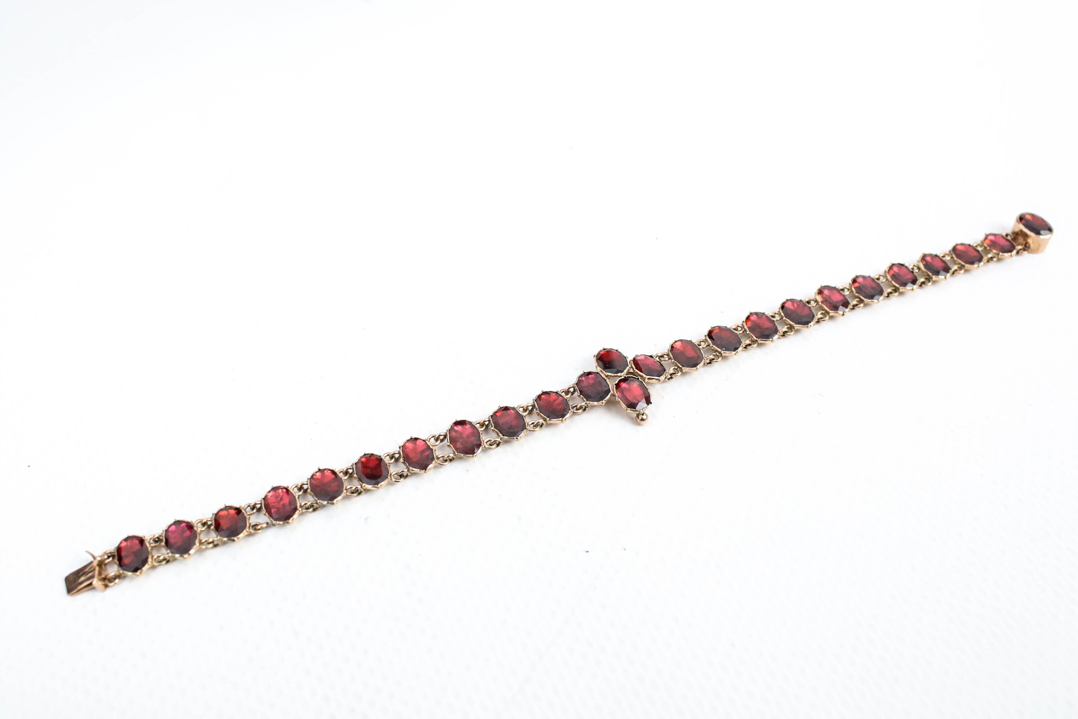 A Victorian rose gold and garnet bracelet in the 18th century style. - Image 2 of 5