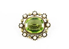 A late Victorian gold, peridot and half-pearl oblong brooch.
