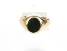 A vintage 9ct gold and bloodstone oval signet ring.