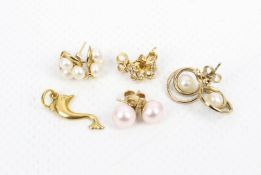 A small collection of gold earrings, including a pair of modern diamond cluster stud earrings.