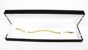 A modern 9ct gold filed-curb link bracelet.