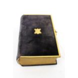 A finely bound presentation copy of The Book of Common Prayer and New Testament, 1857.