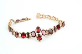 A Victorian rose gold and garnet bracelet in the 18th century style.