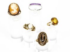 A collection of five vintage 9ct gold and gem-set rings.