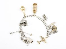A white metal double-curb 'charm' bracelet on a bolt-ring clasp stamped 'Sterling'.