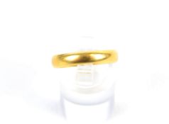An early 20th century 22ct gold wedding band.