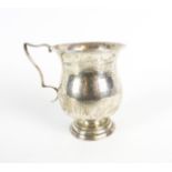 A silver baluster-shaped christening mug.