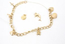 A modern 9ct gold curb-link 'charm' bracelet on a padlock clasp,