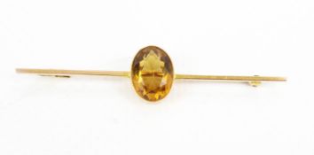 A mid-20th century gold and citrine bar brooch.