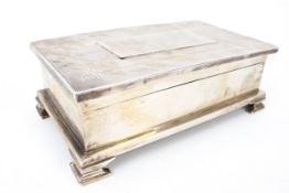 A silver rectangular 'treasury type' cigarette box.