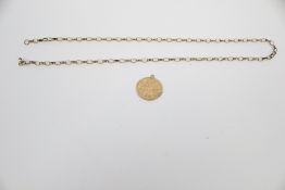 A vintage 9ct gold St Christopher pendant and a chain.