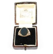 An early 20th century rose gold and oval bloodstone signet ring.
