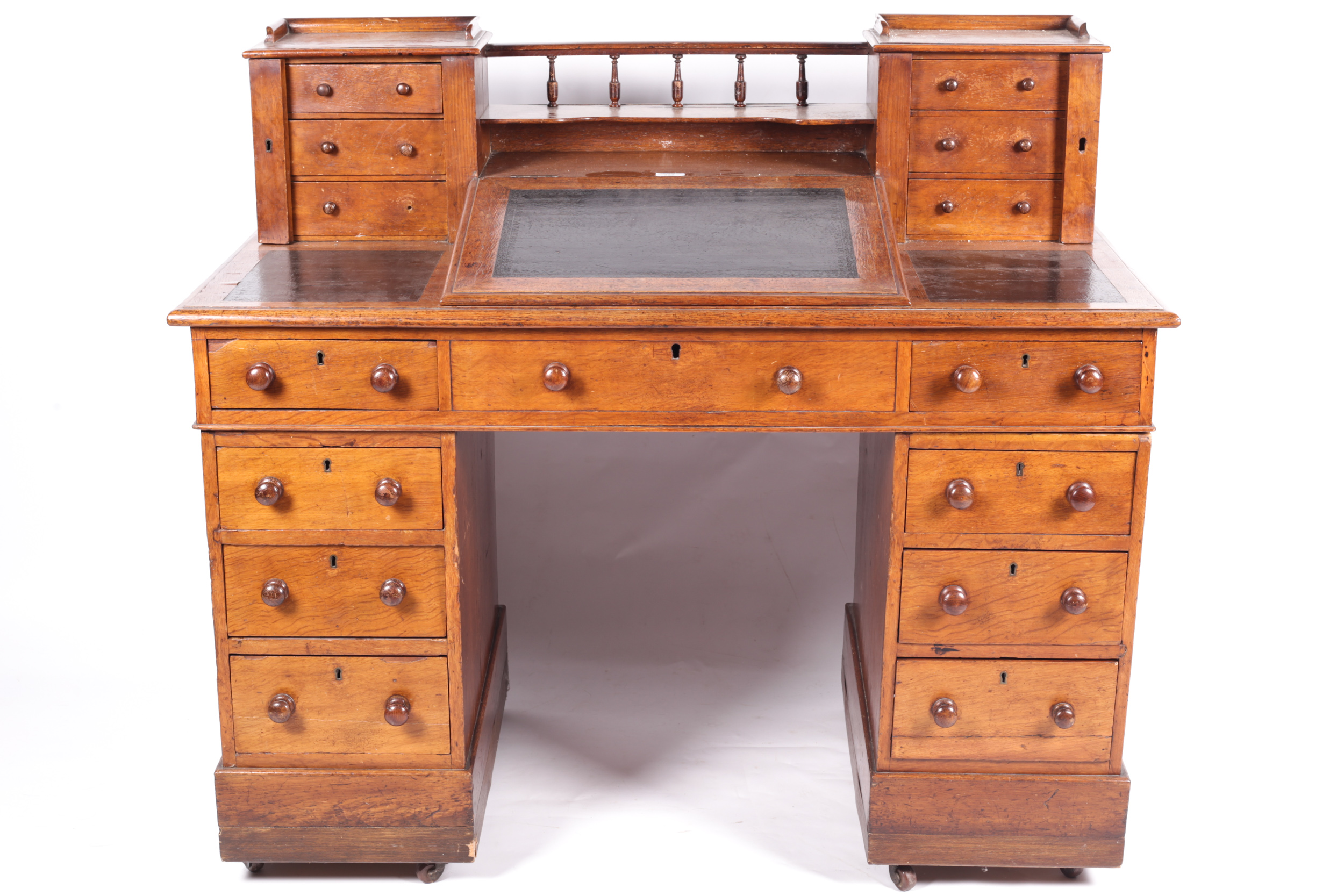 A 19th century stained oak DICKENS desk with slope.