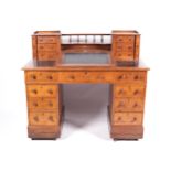 A 19th century stained oak DICKENS desk with slope.