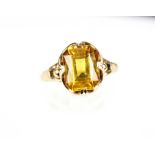 A 9ct gold and rectangular yellow synthetic-sapphire single stone ring. Size O, 3.