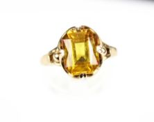 A 9ct gold and rectangular yellow synthetic-sapphire single stone ring. Size O, 3.