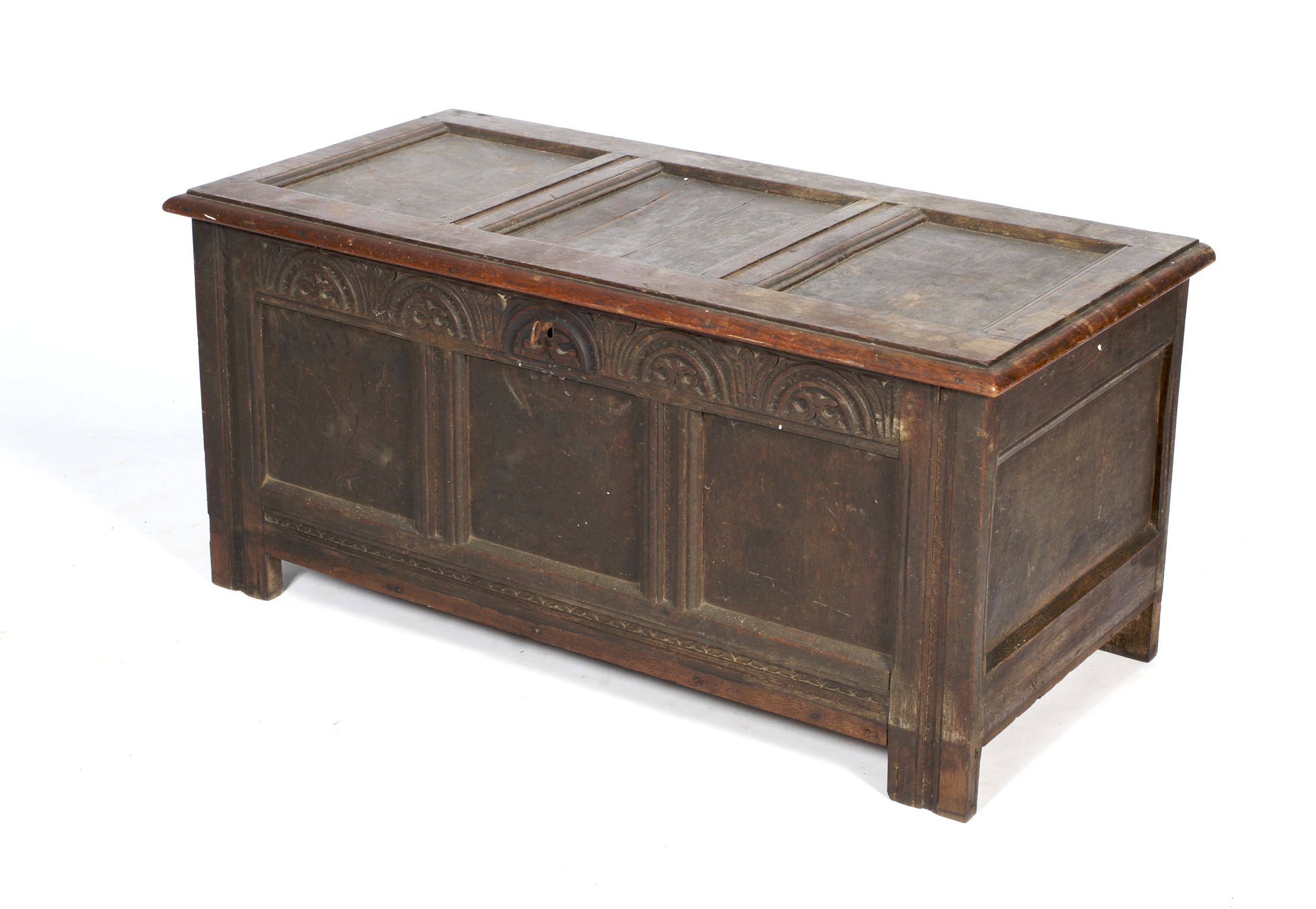 A carved and panelled oak coffer. - Image 2 of 2