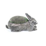 An Edwardian silver pin cushion in the form of a hare.