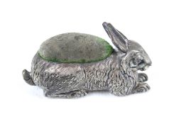 An Edwardian silver pin cushion in the form of a hare.