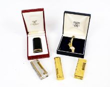 A Must de Cartier and three Dunhill cigarette lighters and a lady's bracelet watch.