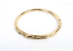 An early 20th century 9ct rose gold hollow slave bangle. Hallmarks for Birmingham 1921, 12.