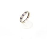 A 9ct white gold, sapphire and diamond eternity ring.