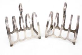 A pair of silver toast racks each with four lancet shaped divisions, mark of W Batty & Sons,