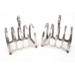 A pair of silver toast racks each with four lancet shaped divisions, mark of W Batty & Sons,