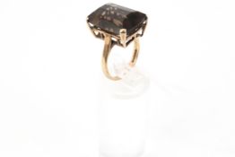 A vintage 9ct gold and rectangular smokey quartz single stone ring.
