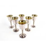 A set of six silver goblets.