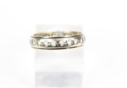 A vintage paste eternity ring. The 4.