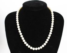 A cultured-freshwater-pearl single row necklace. The beads measure approx. 7.3mm-7.