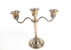 A silver two branch/three light candelabrum.