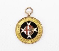G.W.R. Interest, a 9ct gold and enamel '25 Years First Aid Efficiency' medallion.