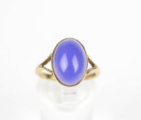 A vintage 9ct gold and oval cabochon blue chalcedony single stone ring.