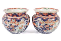 A pair of 19th century Chinese ribbon jardiniere in the Imari palette.