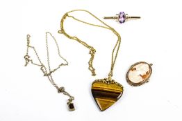 Two 9ct gold mounted brooches and two pendants.