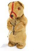 A vintage clockwork toy bear.