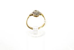 An early/mid-20th century gold and small diamond cluster ring.