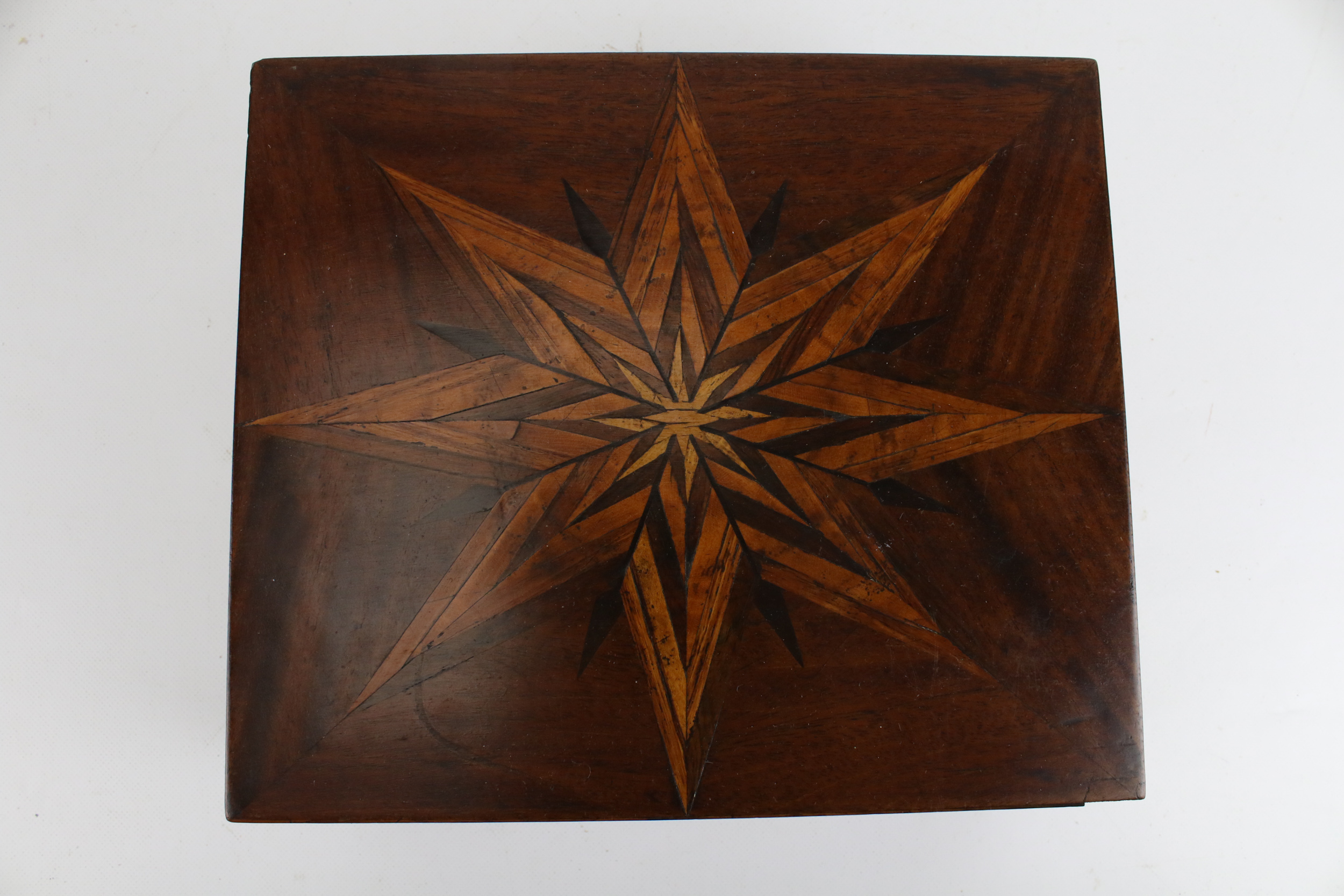 A late 18th century star marquetry inlaid mahogany box. With hinge opening, 11.5 H x 26.5 cm W x 22. - Image 2 of 3