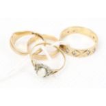 Four vintage 9ct gold rings.
