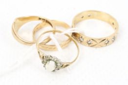 Four vintage 9ct gold rings.